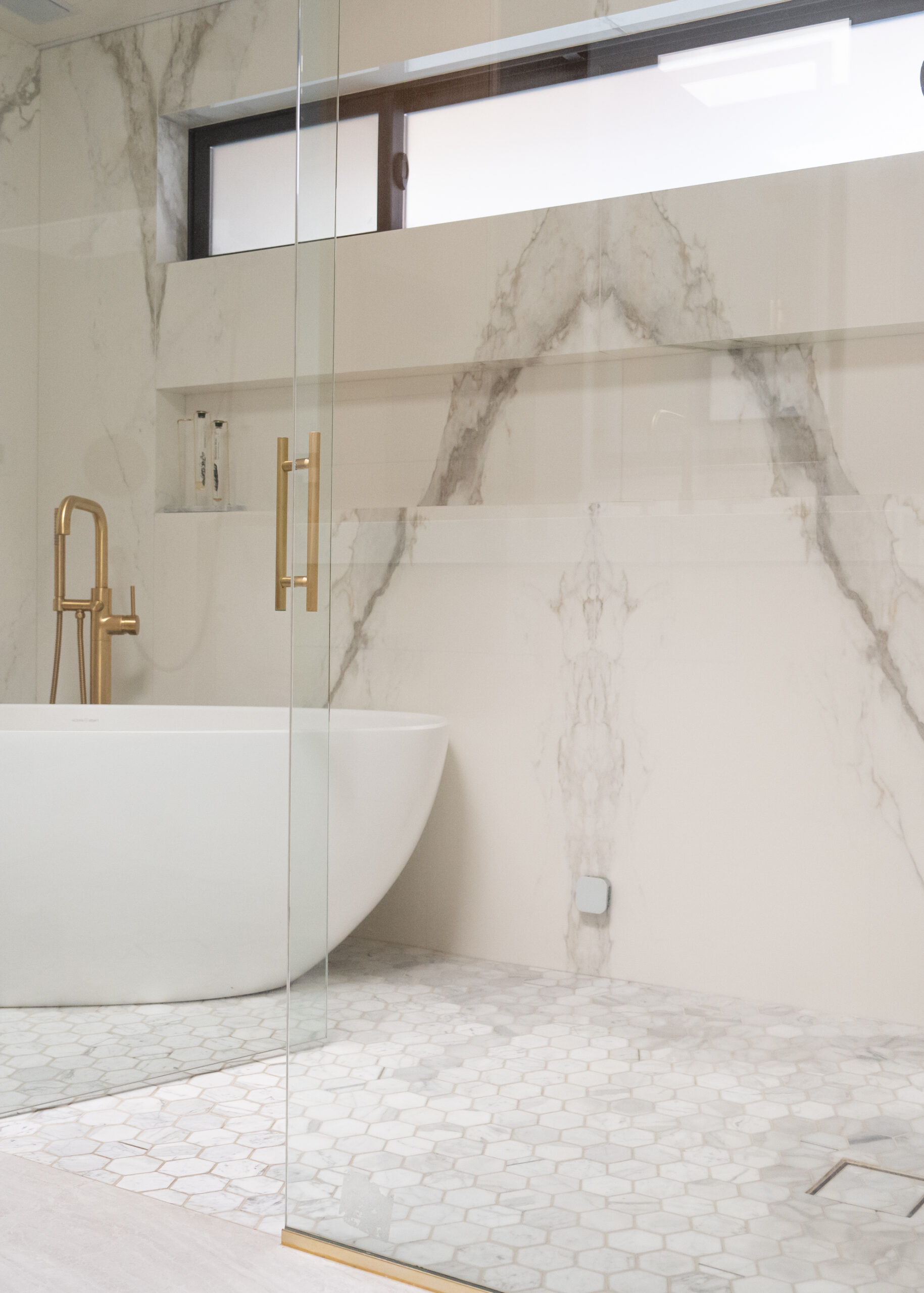 Master bath shower remodel marble and minimalist glass construction